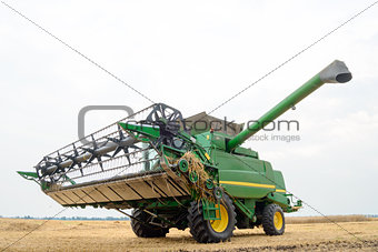 Combine Harvester in the Wheat Field