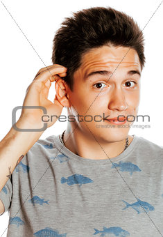 young pretty man isolated hand to ear surprised listening