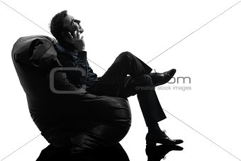 man sitting on the telephone silhouette