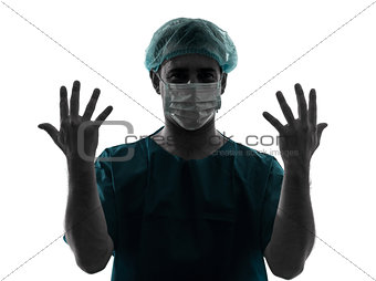 doctor surgeon man portrait with face mask showing hands silhoue