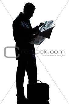 silhouette man full length standing reading newspaper