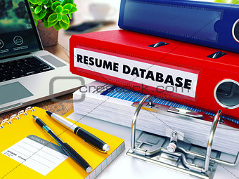 Resume Database on Red Ring Binder. Blurred, Toned Image.