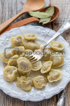 Dumplings and fork on a plate.
