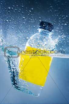Swimming bottle of water in water