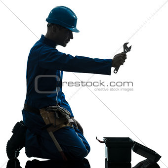 repair man worker despair praying silhouette