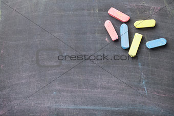 Colorful chalk on blackboard background