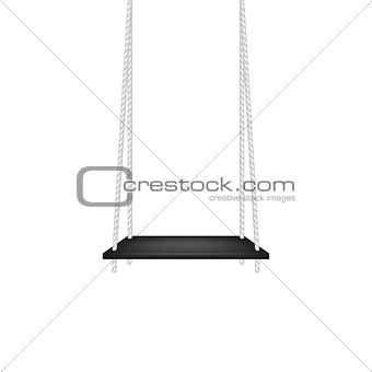 Wooden swing hanging on ropes