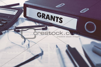 Grants on Office Folder. Toned Image.