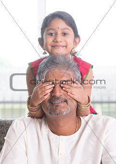Daughter playing with father