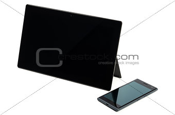 Modern black tablet with cell phone isolated