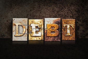 Debt Letterpress Concept on Dark Background