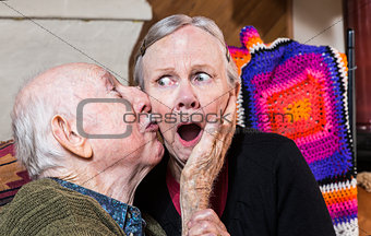 Older Gentleman Kissing Older Woman on Cheek
