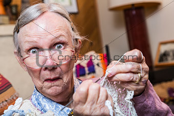 Surprised Woman Sewing