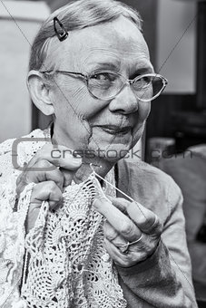 Happy Elderly Woman with Crochet
