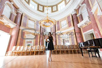 elegant woman in concert hall 