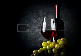Wine with grape on black