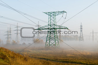 High-voltage power line against autumn landscape