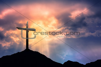 Silhouette of Cross at Sunrise