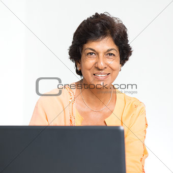 Indian mature woman notebook computer