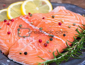 Raw Salmon Fish Fillet with Lemon and Fresh Herbs