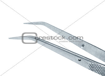 Medical tweezers close-up on an isolated white background