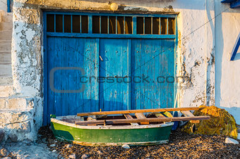 Old Boat at the picturesque fishing village of Klima on the island of Milos, Greece