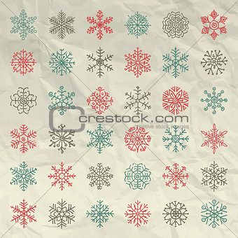 Vector Winter Snow Flakes Doodles on Crumpled Paper