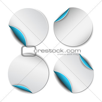 Set of white round stickers with blue backside.