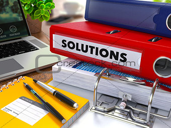 Red Ring Binder with Inscription Solutions.