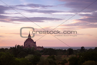 Colorful dramatic sunset of ancient temple in Bagan