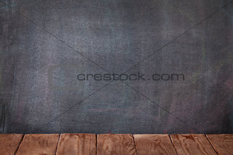 Classroom table in front of blackboard