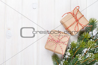 Christmas fir tree with snow and gift boxes