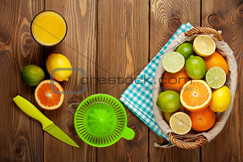 Citrus fruits and glass of juice