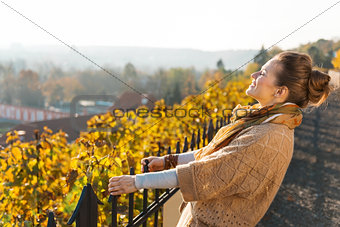Portrait of brown-haired woman relaxing in autumn outdoors