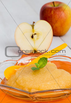 Applesauce with cinnamon and orange spoon