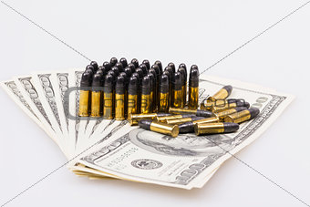 ammunition from the gun on 100 dollar bills