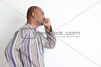 Mature casual Indian man getting new idea