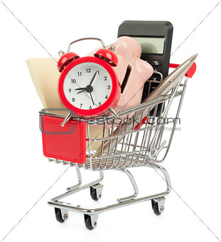 Piggy bank with alarm clock in shopping cart