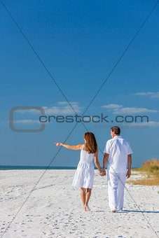 Man Woman Couple Walking Pointing on Empty Beach