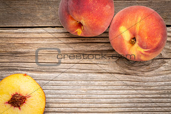peach fruits on weathered wood