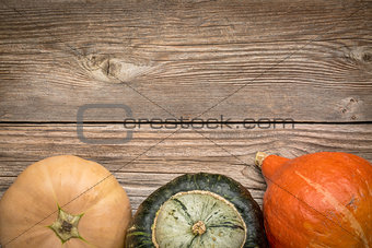 rustic wood background with winter squash