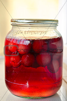 Jar of delicious homemade red cherry compote