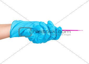 Hand in blue glove holding dental toothpick isolated on a white 