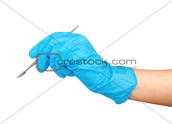 Hand in blue glove holding dental tool isolated on white