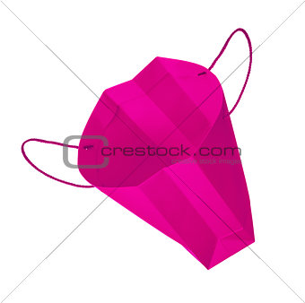 empty pink gift bag falls through the air on an isolated white b