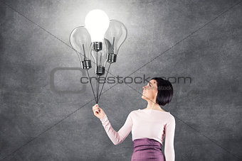 Girl with lightbulbs
