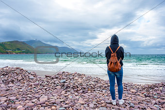 Woman in front of the sea