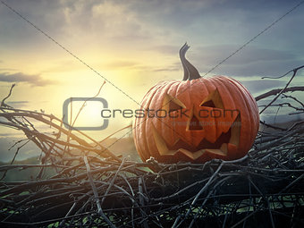 Funny face pumpkin sitting on fence