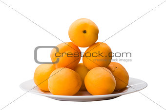 yellow peach slices on plate isolated on white
