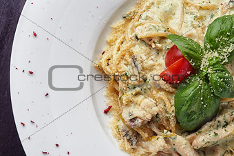 Italian spaghetti with sauce and basil leaf